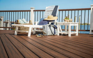 a high quality deck with a comfortable lounge chair with side table