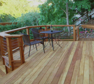 beautiful redwood decking with bistro table set with a bottle of wine