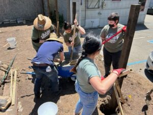 ashby-lumber-volunteers-mixing-concrete